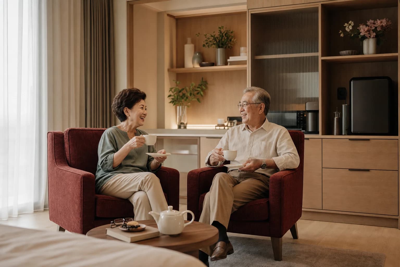A couple relaxing in their private suite lounge
